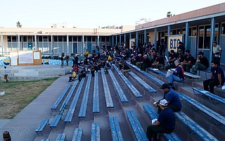 Incident commanders and their teams gather at Dos Pueblos High School, the site of incident command for the Whittier Fire, to go over Thursday evening's briefing.