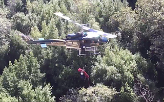 Passnger Mary Scott is hoisted out of the crushed vehicle and to a helicopter after being trapped in the car for more than two hours. She was flown to Cottage Hospital.