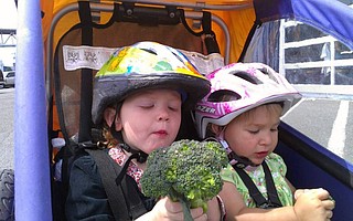 Jen Goldman first used a baby trailer to hold both kids and groceries, but upgraded to a cargo bike when she found, “If your kids are hungry, you might get home and no longer have the broccoli you planned to cook for dinner.”