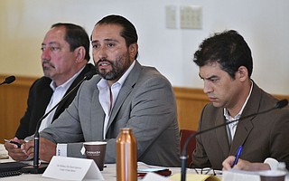 Tribal Chair Kenneth Kahn (center) speaks during a county–Chumash meeting while attorney Sam Cohen (left) and 1st District Supervisor Das Williams listen on.