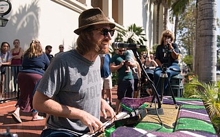 Zach Gill treated passersby on State Street to an impromptu solo gig on the Indy piano, as part of the annual Pianos on State installation.