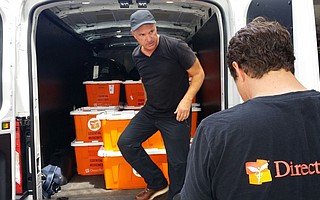Direct Relief CEO Thomas Tighe loads emergency health kits in Puerto Rico.
