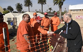 California Governor Jerry Brown shakes hands with California Department of Corrections and Rehabilitation inmate workers after a press conference on the Thomas Fire at the Ventura County Fairgrounds Saturday, December 9, 2017.