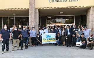 UCSB workers protested at Cheadle Hall on Wednesday, demanding that Chancellor Henry Yang send workers home with paid leave due to Thomas Fire issues.