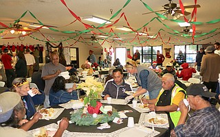 Guests enjoy the Christmas meal.