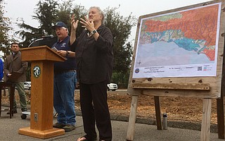 County Public Works Deputy Director Tom Fayram (at the podium) with sign language interpreter Jo Black at Carpinteria City Hall