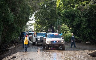 Search & Rescue personnel make their way up and down Hot Springs Road, conducting vehicle and watercraft rescues.