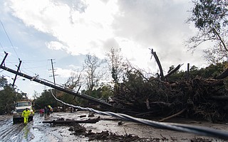 Dazed residents survey wreckage at the intersection of Hot Springs and Olive Mill roads