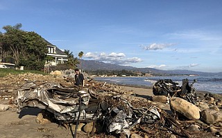 The force of the flash flooding Tuesday morning left a crumpled Hummer H3 and a Honda at the mouth of Montecito Creek.