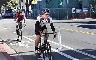 Riders cruise along the new Cota Street bike path