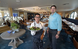 Server Daniel Cruz (left) with General Manager Colin Lohenry