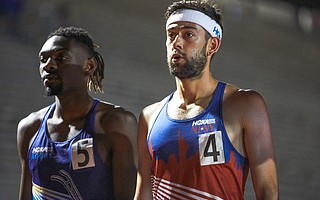 After spectators were invited to gather in the outside lanes of the track, the Hoka One One Elite Mile started with Kyle Merber (4) winning the barrier-busting men’s mile in 3:57.74.