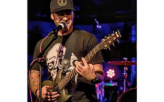 Kyle Smith, who melds rock and reggae into his acoustic ballads, is just one of the musicians slated to play at The Happy Concert.
