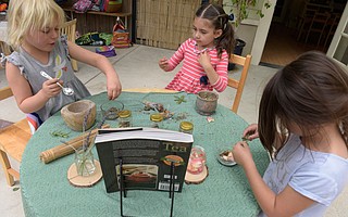 Izzie, Eloise, and Mia make some mindful tea at Bright Start Child Development Center.