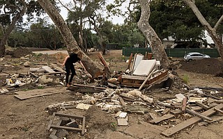 A pile of broken furniture and pieces of drywall is all that is left of the home that belonged to Brian and Karen MacDonald at 620 Randall Road. Some of the property owners on Randall are looking into the possibility of selling their land for a debris basin.