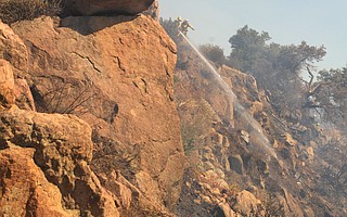 Firefighters mop up after the roughly 20-acre Lookout Fire, in 2012, off San Marcos Pass,
an area that hasn’t burned extensively since 1990.