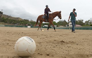 The author receives instruction from Jeff Scheraga