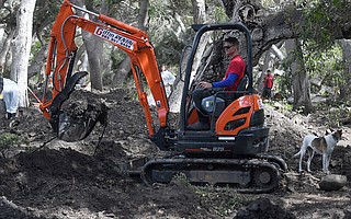Bucket Brigade founder Abe Powell, seen here operating a mini-excavator, writes that funds are needed to complete the cleanup and the search for two missing children in Montecito.