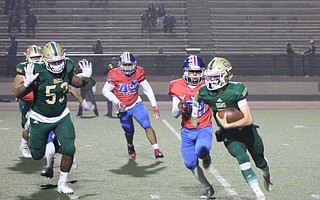 Frankie Gamberdella scrambles in rivalry game against San Marcos Friday night at La Playa Stadium.