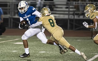 Santa Barbara defensive back Salomon Manzanarez brings down Joshua Ford after a long run.