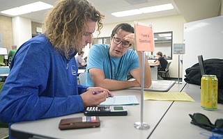 SBCC student Chad Mills (left) gets some assistance from Math Lab tutor Theo Bullock.