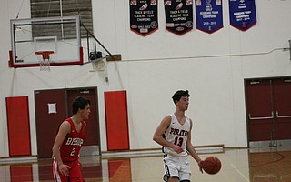 Nate Rogers surveys the Bishop Diego defense.