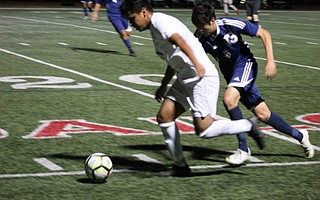Juan Carlos Torres gets by Dos Pueblos defender Robert Montalvo