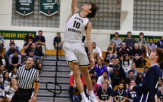 Jackson Hamilton skys for a transition layup.