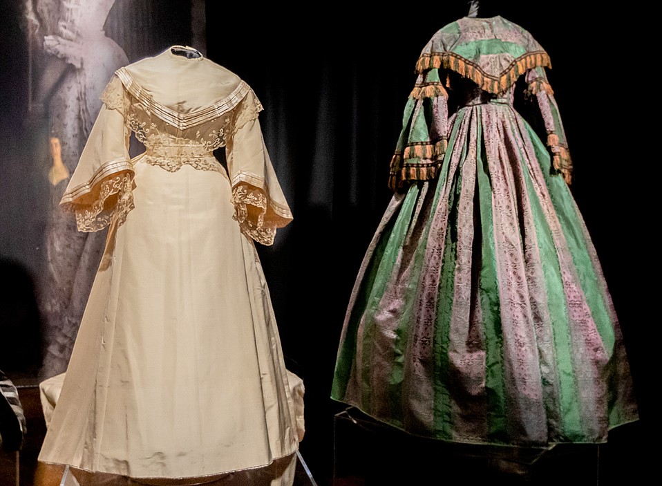 From Left: De la Guerra silk wedding dress (1836) and Trousseau green taffeta and cotton gown (1857)