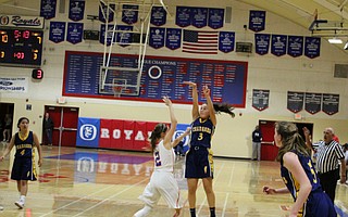 Ashley Gerken goes up for a three-pointer over the tight defense of Alex Guadagno.
