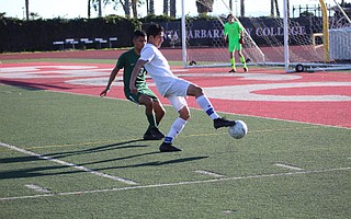 Miguel Mondragon protects the ball from Santa Barbara defender Alberto Vargas