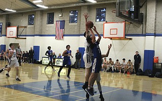 Mason Oetgen drives to the rim.