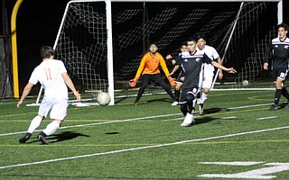 Carpinteria goalkeeper Adrian Gonzalez and a host of defenders thwart a shot attempt by Santa Ynez forward Sam Villa