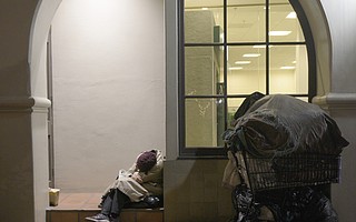 A homeless woman sleeping on State Street on a cold January night.