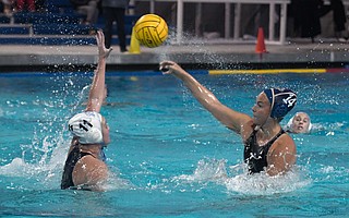 Abbi Hill (14), Dos Pueblos High’s UCLA-bound water polo player, takes a shot with Corona del Mar defender Sophie Warren (11) confronting her in the CIF playoffs. Dos Pueblos had five wrestlers compete in the CIF girls’ regionals, including Julisa Leyva Diaz and Paola De La Cruz.