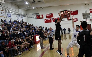 Mateo Handall is fouled on a corner three pointer.