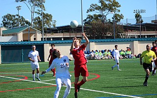 Harry Powers goes up for a header.
