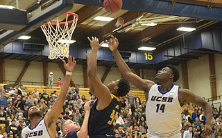 Ami Lakoju (14) fights for a rebound against UC Irvine this season.
