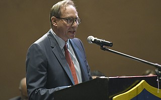 Attorney Eric Early speaking at a School Board meeting in 2018
