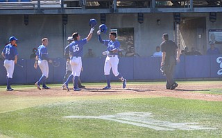 Armani Smith celebrates his two-run homer in the bottom of the fifth inning.