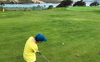 The author’s son, Mason, tees off at Sea Pines Golf Course in the morning and jumps in Montaña de Oro tide pools in the afternoon.